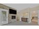 Cozy Gathering room with fireplace, bar, and stairs leading to the bedroom at 9044 Opus Dr, Las Vegas, NV 89117