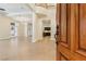Grand foyer featuring tile floors, soaring ceilings, elegant columns, and views of the kitchen and living areas at 9044 Opus Dr, Las Vegas, NV 89117
