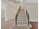 Grand foyer features a staircase with iron railings and an open floor plan at 9044 Opus Dr, Las Vegas, NV 89117
