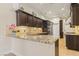 Modern kitchen with granite countertops, stainless steel appliances, and custom cabinets at 9044 Opus Dr, Las Vegas, NV 89117