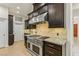 This kitchen features stainless steel appliances, custom cabinetry, and granite countertops at 9044 Opus Dr, Las Vegas, NV 89117