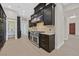 Gourmet kitchen featuring stainless steel appliances, dark wood cabinets, and a spacious pantry at 9044 Opus Dr, Las Vegas, NV 89117