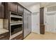 Gourmet kitchen boasts stainless steel appliances, double ovens and custom cabinetry at 9044 Opus Dr, Las Vegas, NV 89117