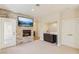 The living room is complete with a fireplace, bar area, and access to outdoors at 9044 Opus Dr, Las Vegas, NV 89117