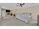 Spacious main bedroom with fireplace, tv, and neutral color scheme at 9044 Opus Dr, Las Vegas, NV 89117