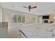 Bright main bedroom with large windows and fireplace at 9044 Opus Dr, Las Vegas, NV 89117