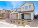 Stunning two-story house with tile roof, brick driveway, and manicured front yard at 9259 Lunar Phase St, Las Vegas, NV 89143