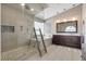 Modern bathroom with a glass-enclosed shower, soaking tub, and a double sink vanity at 9417 Grenville Ave, Las Vegas, NV 89134