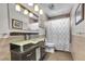 Stylish bathroom with a glass sink, modern vanity, and decorative shower curtain at 9417 Grenville Ave, Las Vegas, NV 89134
