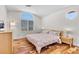 Bright bedroom with hardwood floors, lots of natural light, and modern light fixtures at 9417 Grenville Ave, Las Vegas, NV 89134