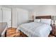 Cozy bedroom with hardwood floors, neutral decor, and a large closet at 9417 Grenville Ave, Las Vegas, NV 89134