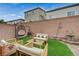 Relaxing backyard featuring outdoor seating and a serene fountain at 9835 Fox Estate St, Las Vegas, NV 89141