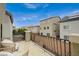 Outdoor balcony featuring wicker seating and wrought iron railings with a view of the neighborhood at 9835 Fox Estate St, Las Vegas, NV 89141