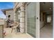 Spacious balcony with stone accents offers seamless indoor-outdoor flow, enhancing modern living at 9835 Fox Estate St, Las Vegas, NV 89141