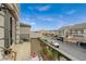 Balcony with a view of the neighborhood and street, defined by sturdy railings and outdoor living space at 9835 Fox Estate St, Las Vegas, NV 89141