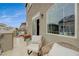 Relaxing outdoor balcony area featuring wicker chairs, scenic views, and sliding glass doors at 9835 Fox Estate St, Las Vegas, NV 89141