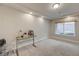 Versatile bonus room with neutral walls, carpet floors, and a window for natural light at 9835 Fox Estate St, Las Vegas, NV 89141