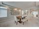 Elegant dining room with stylish decor, open to kitchen and staircase, ideal for Gathering gatherings at 9835 Fox Estate St, Las Vegas, NV 89141