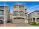 Modern three-story home with a two-car garage at 9835 Fox Estate St, Las Vegas, NV 89141