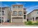 Charming three-story home with a two-car garage, balcony, and well-maintained landscaping at 9835 Fox Estate St, Las Vegas, NV 89141