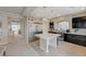 Spacious kitchen featuring stainless appliances, an island, and dark wood cabinetry at 9835 Fox Estate St, Las Vegas, NV 89141
