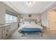 Serene main bedroom with recessed lighting, plush carpet, and large windows for ample natural light at 9835 Fox Estate St, Las Vegas, NV 89141