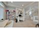 Bright office space featuring built-in bookshelves and an adjacent hallway at 9835 Fox Estate St, Las Vegas, NV 89141
