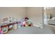 Cozy playroom with dollhouse, toy kitchen and plenty of stuffed animals at 9835 Fox Estate St, Las Vegas, NV 89141