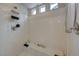 This bathroom features a stand up shower with a built-in seat and a shower head at 9835 Fox Estate St, Las Vegas, NV 89141