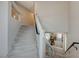 Carpeted staircase with white railing, leading to the upper level of the home at 9835 Fox Estate St, Las Vegas, NV 89141