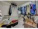 Walk-in closet with wire shelving, clothing racks, and storage bins at 9835 Fox Estate St, Las Vegas, NV 89141