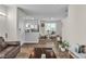 Open concept living room flows into the dining area and kitchen, perfect for entertaining guests at 12268 Desert Light Rd # 1, Las Vegas, NV 89183