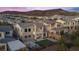 Aerial view of home featuring a backyard with putting green, patio, and mountain views at 13 Scenic Terrain Ave, Henderson, NV 89011