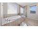 Contemporary bathroom with a luxurious soaking tub and glass shower at 13 Scenic Terrain Ave, Henderson, NV 89011