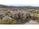 Exterior shot of home with desert landscaping and mountain views at 13 Scenic Terrain Ave, Henderson, NV 89011