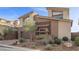 Charming two-story home with a landscaped yard, modern design, and a single car garage at 13 Scenic Terrain Ave, Henderson, NV 89011