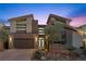 Contemporary two-story home with modern design, desert landscaping, and a two-car garage at 13 Scenic Terrain Ave, Henderson, NV 89011