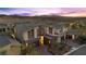 Elegant modern desert home with multi-car garage, stone accents, and beautiful desert landscaping at 13 Scenic Terrain Ave, Henderson, NV 89011