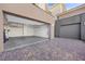 Spacious two-car garage with ample storage and a paved driveway, offering convenience at 13 Scenic Terrain Ave, Henderson, NV 89011