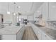 Contemporary kitchen with a large island, granite countertops, stainless steel appliances, and ample cabinet space at 13 Scenic Terrain Ave, Henderson, NV 89011