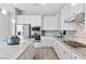 Modern kitchen boasting stainless steel appliances, granite countertops, and a stylish island at 13 Scenic Terrain Ave, Henderson, NV 89011
