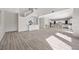 Expansive living space featuring sleek tile flooring, access to kitchen, and modern design elements at 13 Scenic Terrain Ave, Henderson, NV 89011