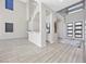 Open-concept living space with high ceilings, modern finishes, and abundant natural light from large windows at 13 Scenic Terrain Ave, Henderson, NV 89011