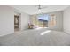 Spacious primary bedroom with seating area, mountain views, and access to a private balcony at 13 Scenic Terrain Ave, Henderson, NV 89011