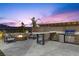 A covered outdoor kitchen and gas fire pit offer outdoor living at its finest at 13 Scenic Terrain Ave, Henderson, NV 89011