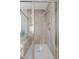 Stylish walk-in shower featuring gray tiling and a built-in bench at 13 Scenic Terrain Ave, Henderson, NV 89011