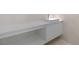 Minimalist bathroom vanity with a white countertop, modern sink, and sleek cabinetry at 1455 Macdonald Ranch Dr, Henderson, NV 89012
