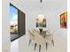 Bright modern dining area with marble floors and contemporary chandelier at 1455 Macdonald Ranch Dr, Henderson, NV 89012