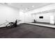 Bright home gym featuring mirrored wall, mounted TV, and stationary bicycle at 1455 Macdonald Ranch Dr, Henderson, NV 89012
