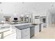 Bright, open kitchen with an island, stainless steel appliances, and a view of the living area at 1455 Macdonald Ranch Dr, Henderson, NV 89012